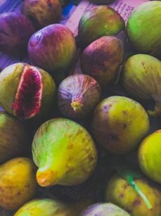 A generous pile of freshly harvested purple and green fig fruits