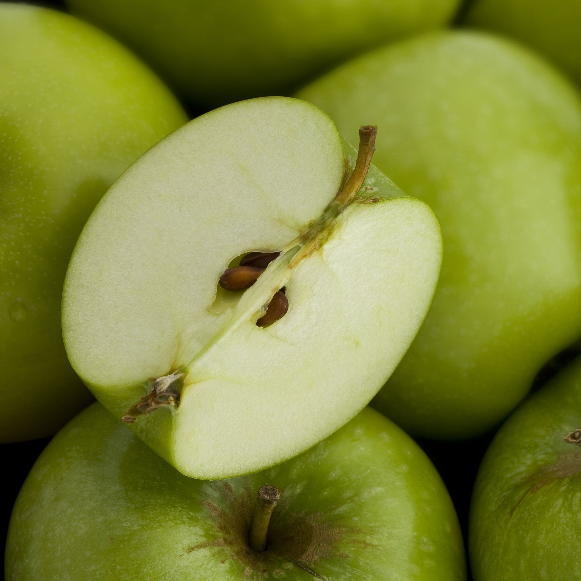 Cross-section of a fresh apple with visible core and seeds