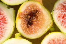 Sliced open fig fruit showing signs of internal souring or rot