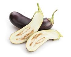 Whole and halved eggplant illustrating seed saving potential
